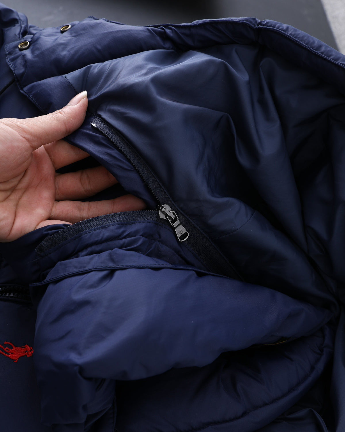 Navy Polo puffer jacket interior and zipper detail