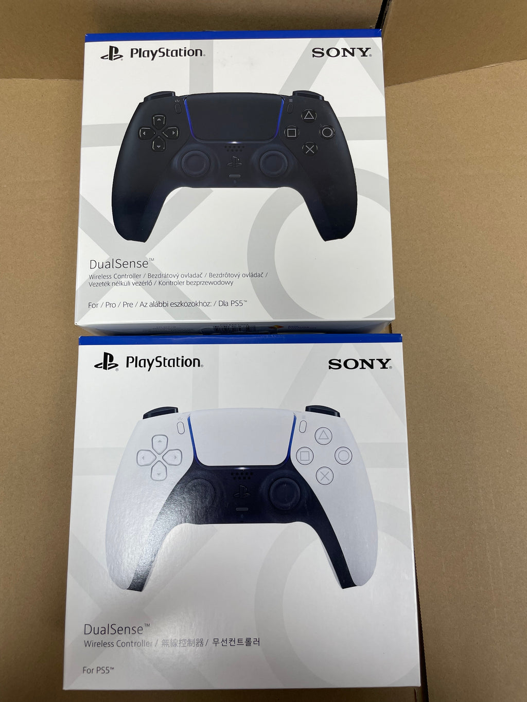 White PS5 DualSense controller shown from front, back, and side angles