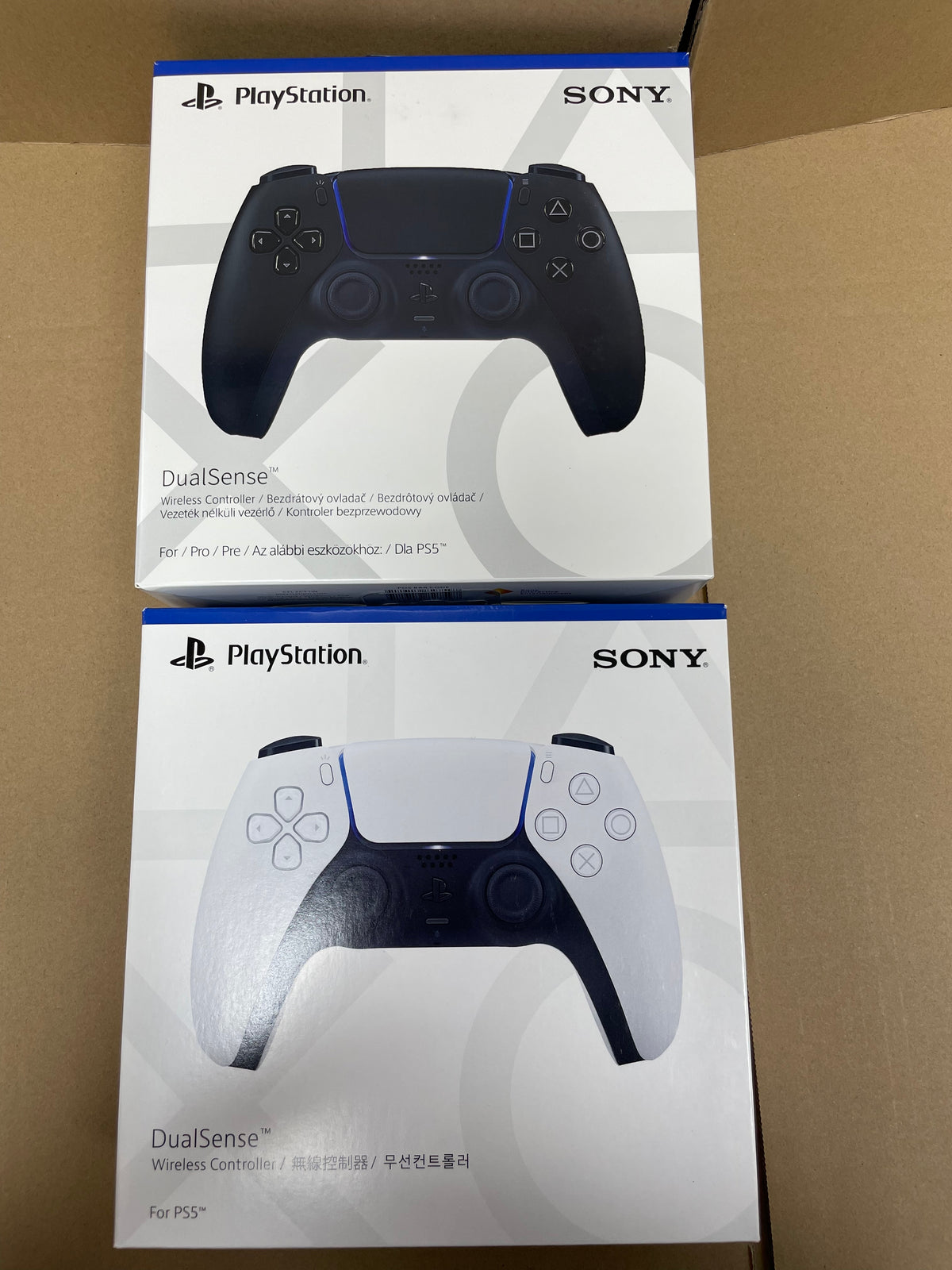 White PS5 DualSense controller shown from front, back, and side angles