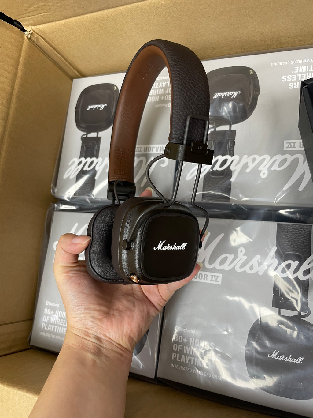 Close-up of the underside and compliance markings on Marshall Major IV headphones