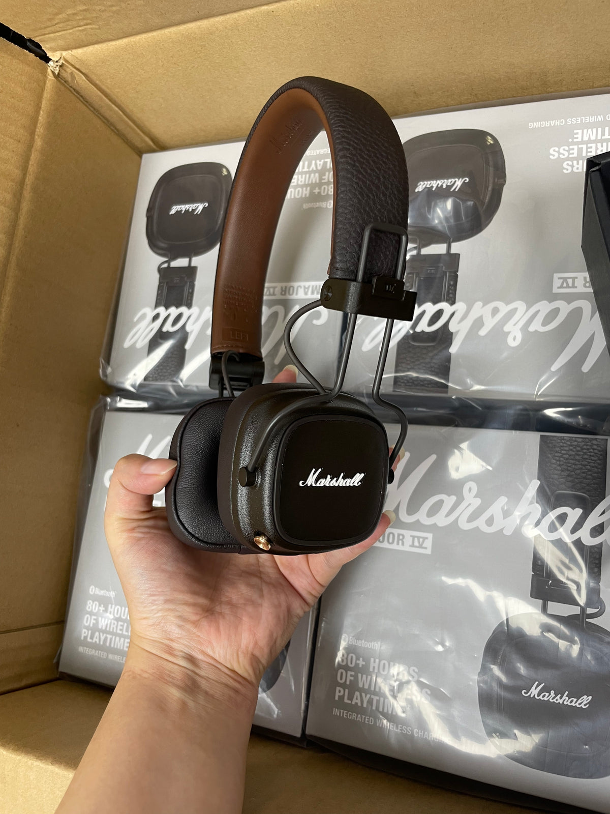 Close-up of the underside and compliance markings on Marshall Major IV headphones