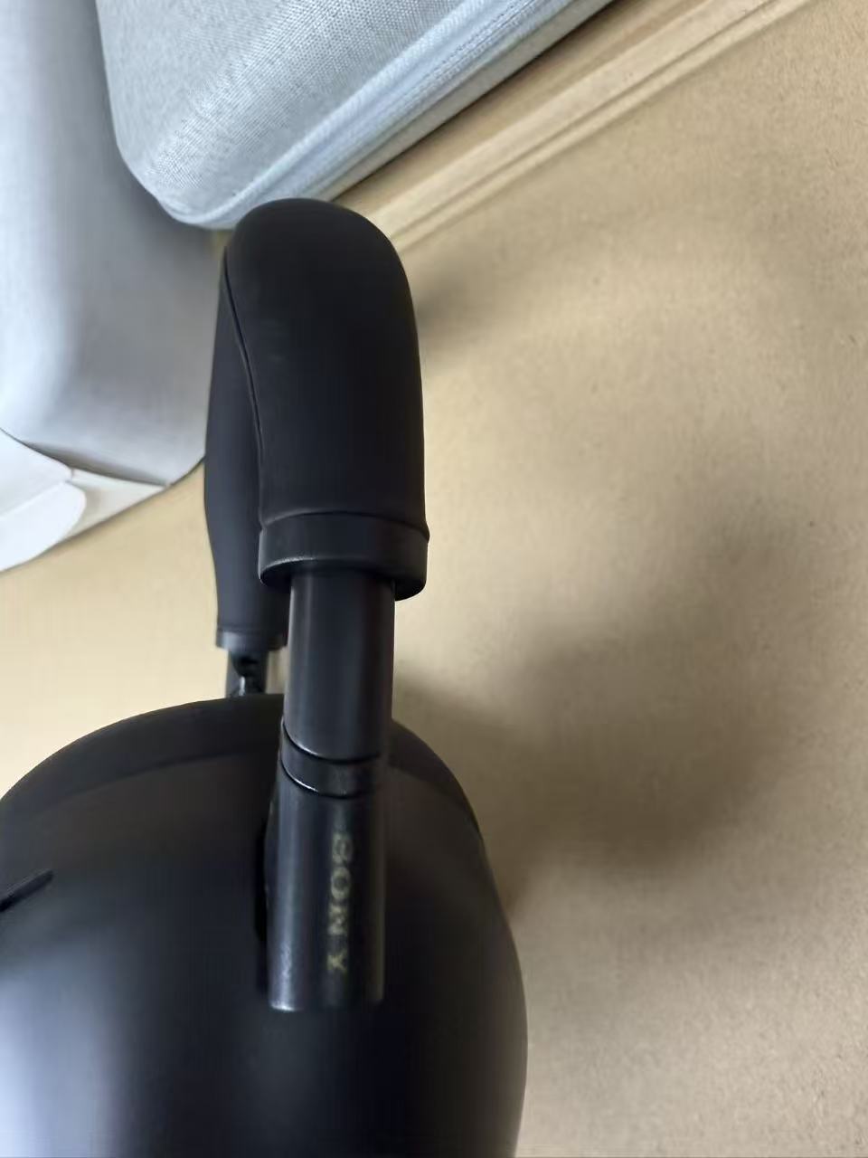 White Sony WH-1000XM6 headphones with case and accessories