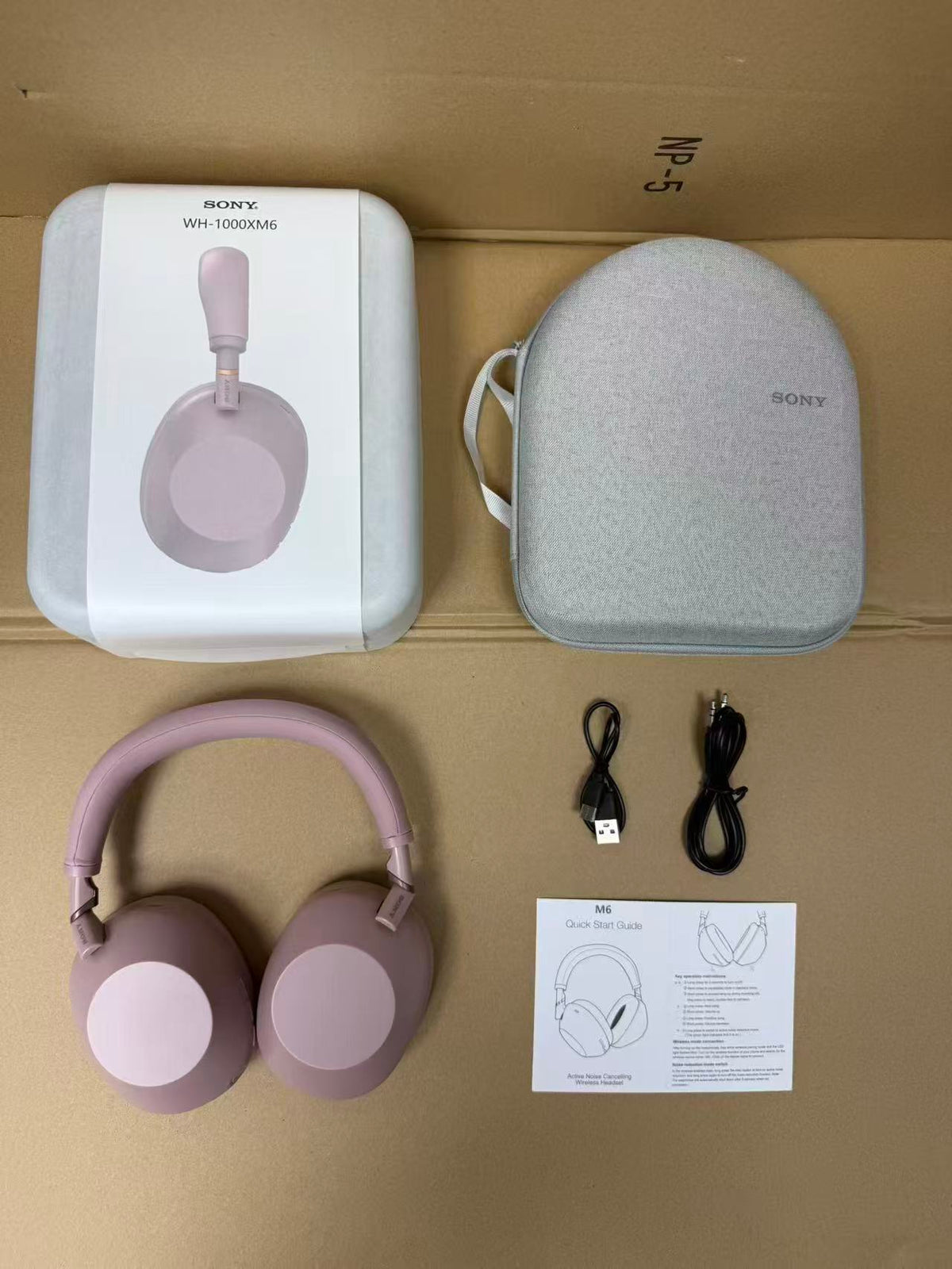 Pink Sony WH-1000XM6 headphones with case and accessories