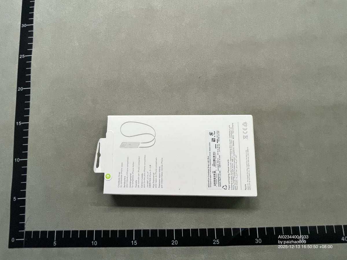 Blue crossbody phone strap in packaging