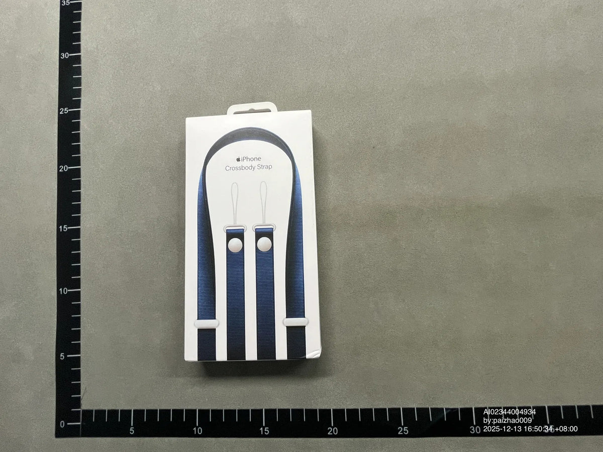 Black crossbody phone strap in packaging