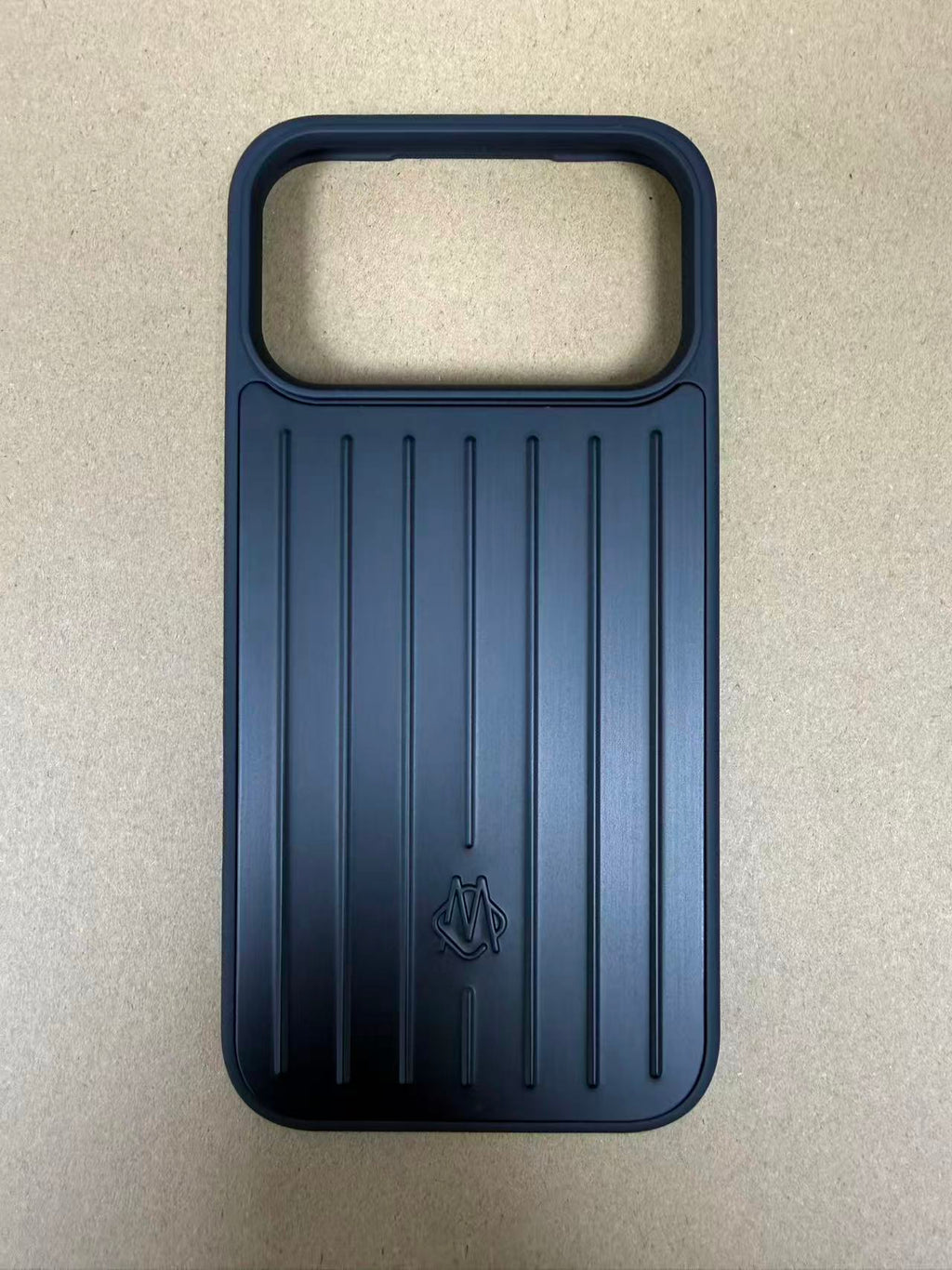 Black luggage-style iPhone 17 Pro Max case with packaging