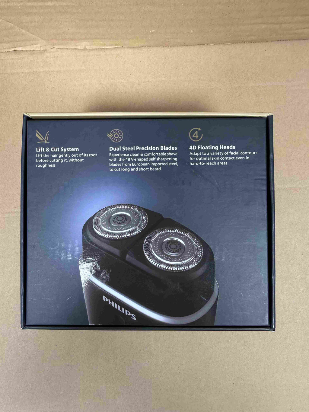 Back of Philips Portable Shaver 700 Series packaging with product features