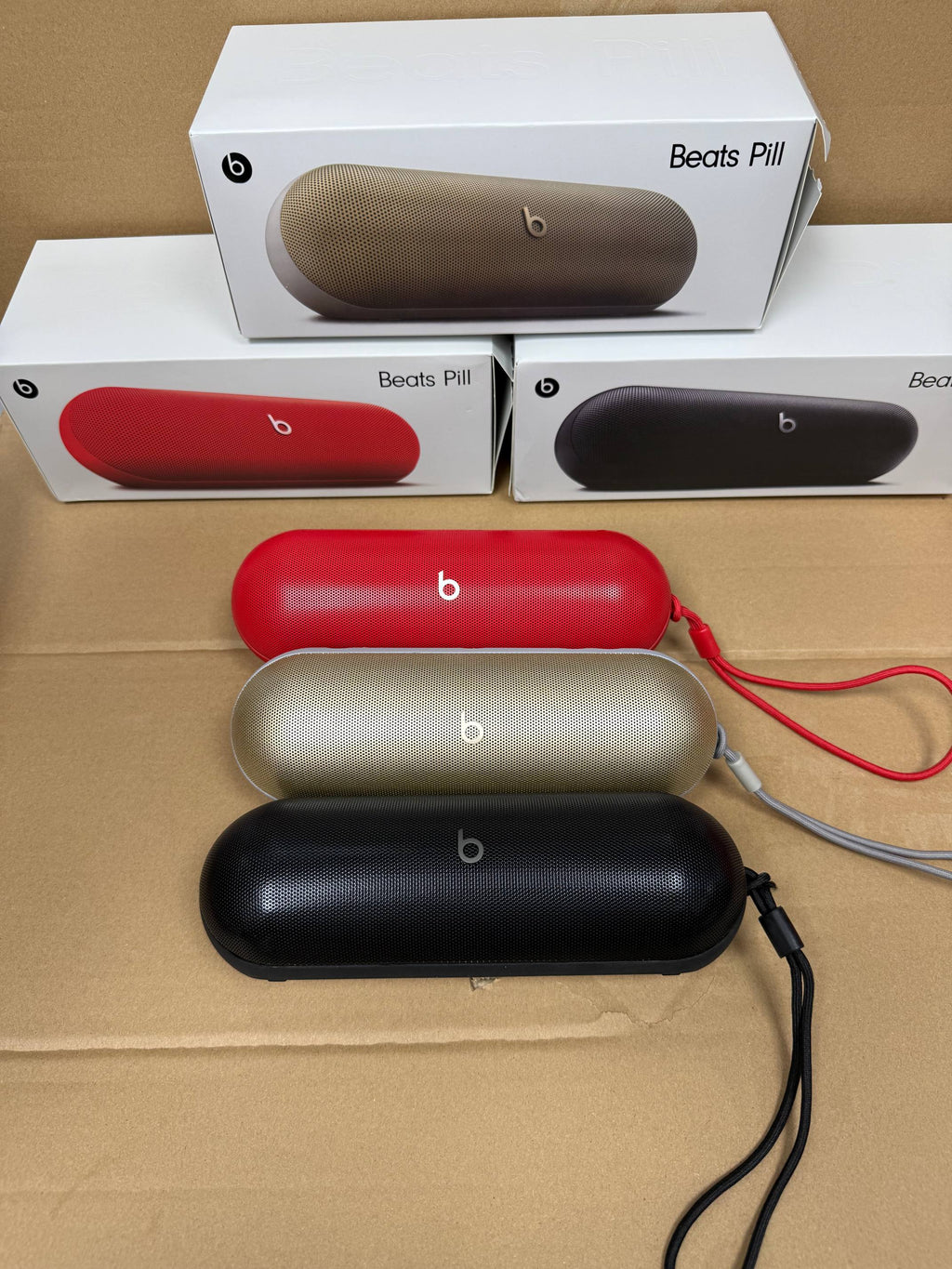 Red Beats Pill portable speaker connected to a smartphone