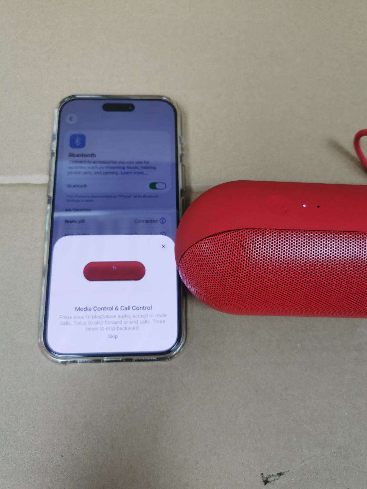 Beats Pill speakers in red, black, and champagne gold