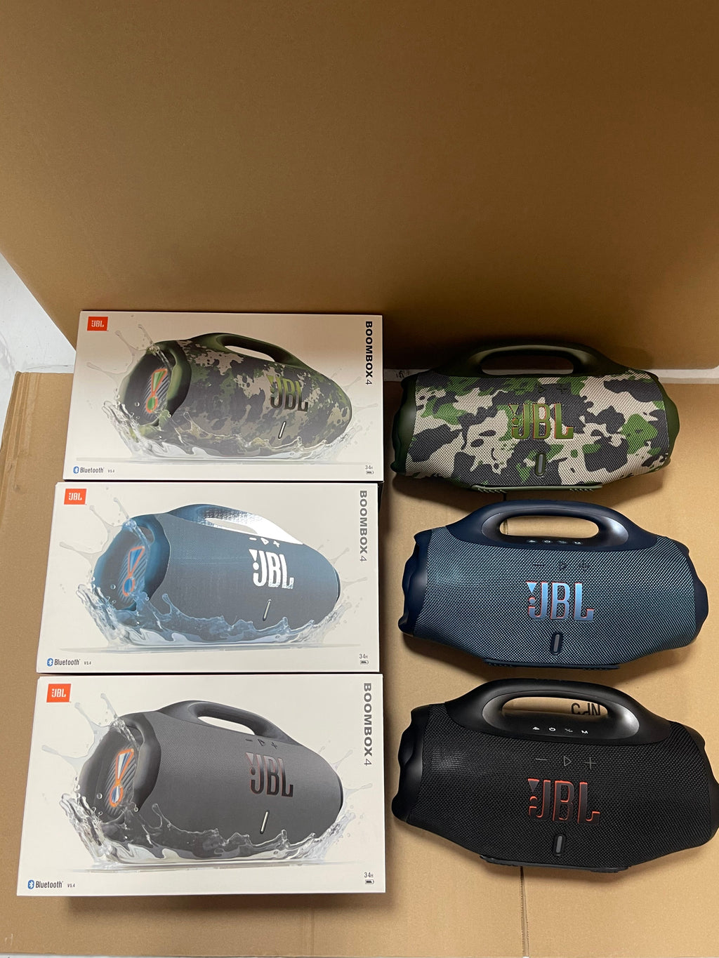 Green and blue JBL Boombox 4 portable speakers