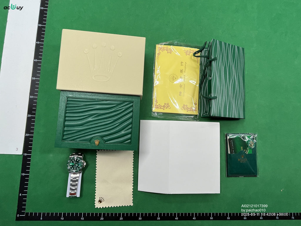 Rolex watch displayed in green presentation box