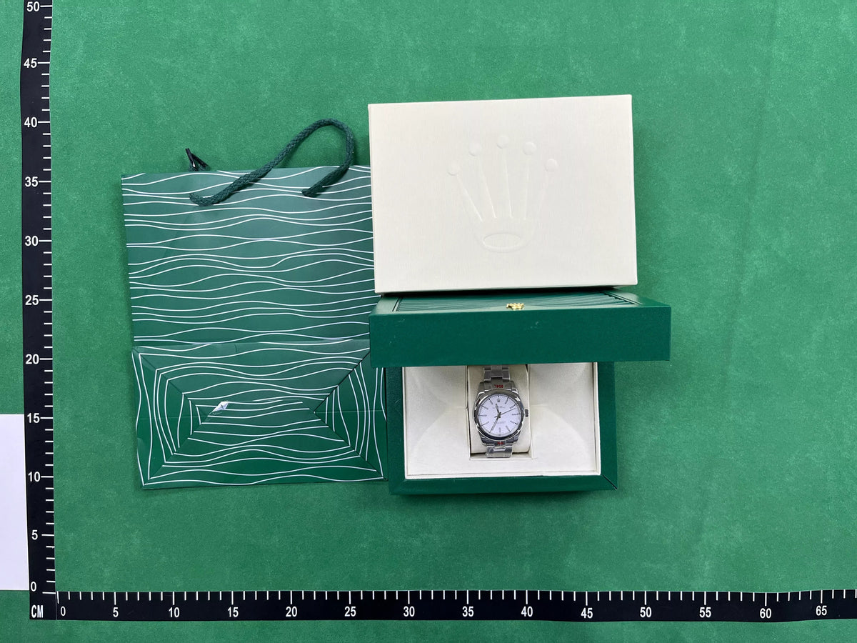 Rolex silver watch with white dial