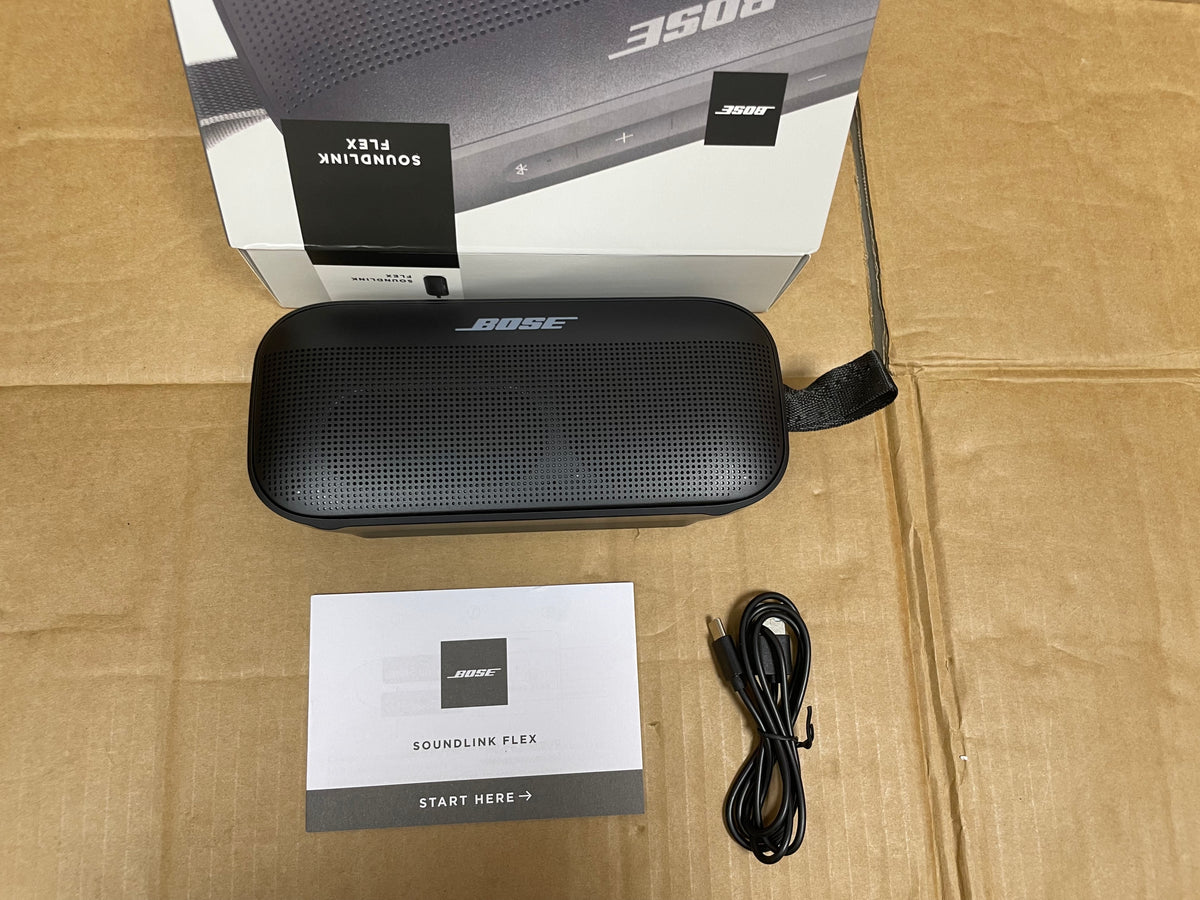 Bose SoundLink Flex speaker with case, cable, and guide