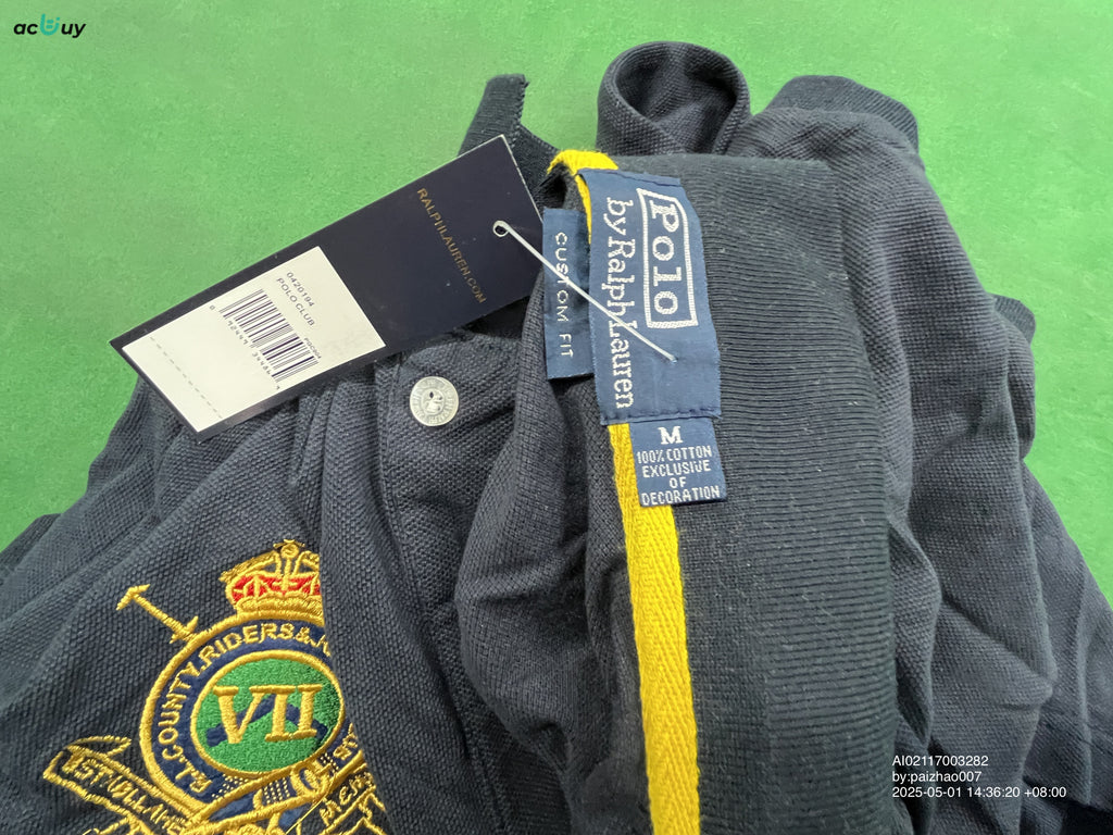 Black embroidered polo shirt shown from the front