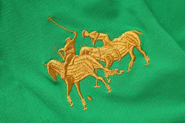 Close-up of embroidered equestrian crest on polo shirt