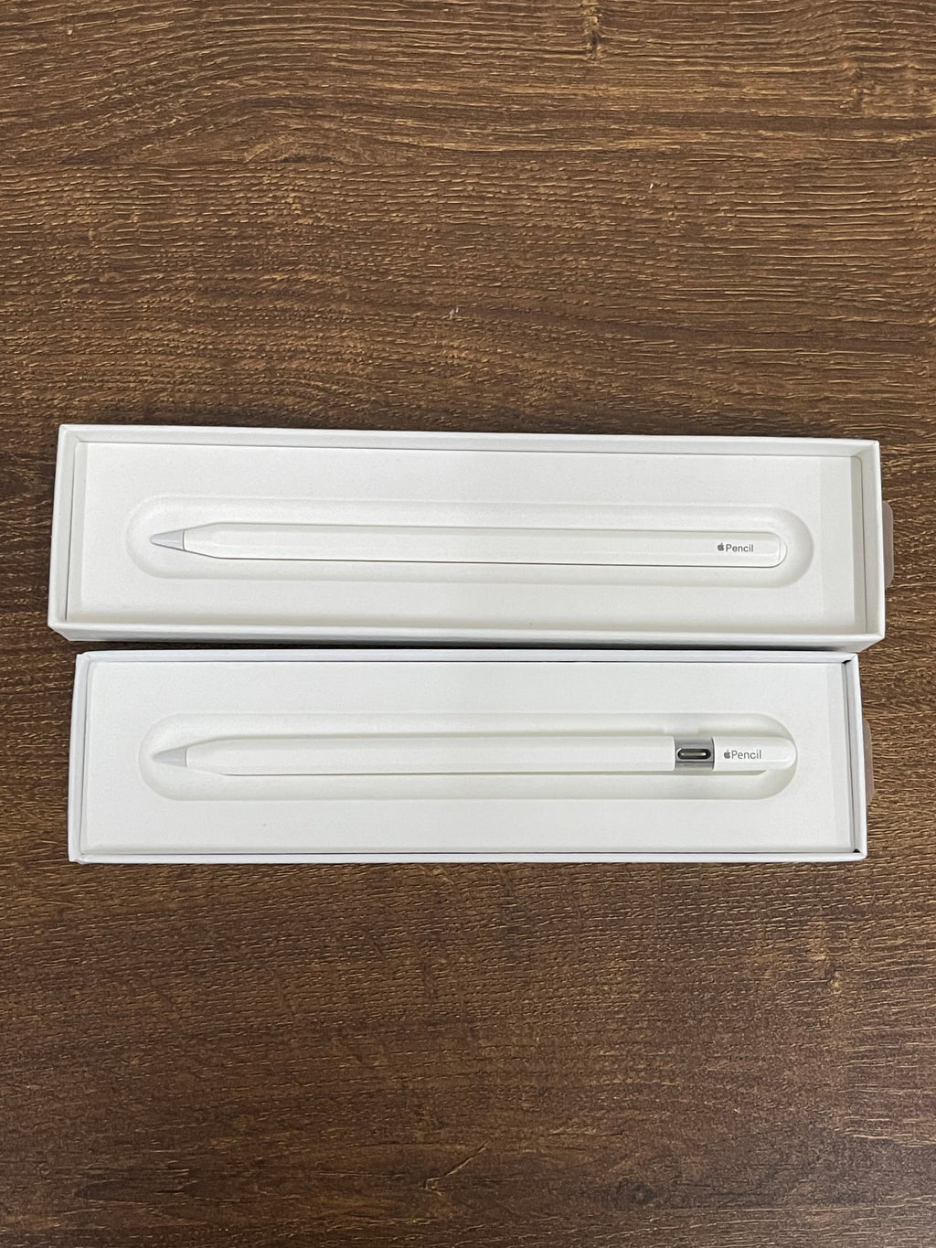 Apple Pencil retail boxes showing the white stylus
