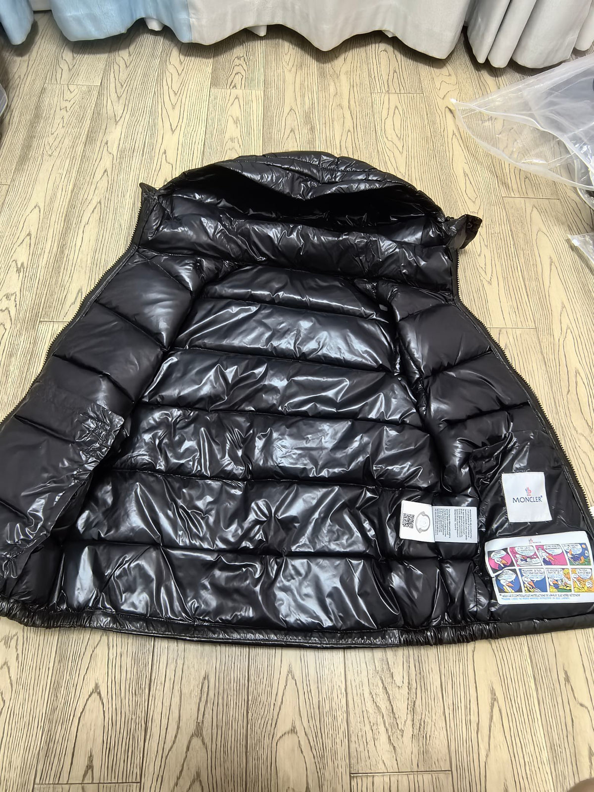 Interior lining and garment labels of black puffer vest