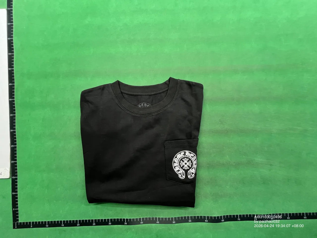 Folded black graphic shirt with chest pocket emblem